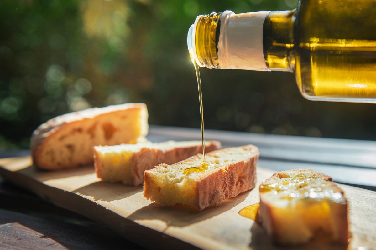 Oil poured over bread at the table